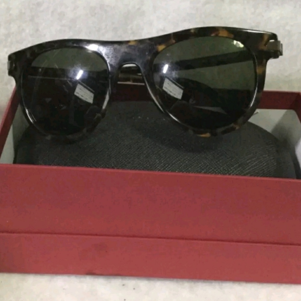 sold Ferrargamo sunglasses nib